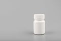 Medicine white pill bottle on grey background