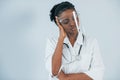 Medicine worker. Young african american woman is against white background