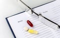 Medicines. Capsules with tablets are in the planner. A medication plan Royalty Free Stock Photo