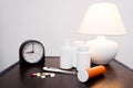 Medicines, clock and lamp Royalty Free Stock Photo