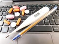 Medicines on the keyboard of a computer.
