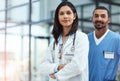 Medicines most dedicated team. Portrait of two confident young doctors working in a modern hospital. Royalty Free Stock Photo