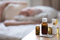 Medicines and pills lying on bedside table of elderly Royalty Free Stock Photo