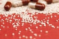 medicines scattered on a red background pills and their contents