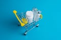 Medicines in a shopping cart for a shopper. The concept of medicine and the cost of treatment