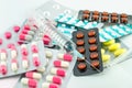 Medicines and syringe on white background