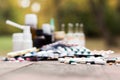 Medicines on wooden table, nature bokeh background Royalty Free Stock Photo
