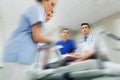 Medics and patient on hospital gurney at emergency Royalty Free Stock Photo