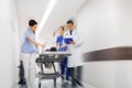 Medics and patient on hospital gurney at emergency Royalty Free Stock Photo