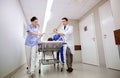 Medics and patient on hospital gurney at emergency Royalty Free Stock Photo