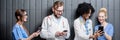 Medics with phones indoors Royalty Free Stock Photo