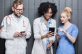 Medics with phones indoors Royalty Free Stock Photo