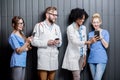 Medics with phones indoors Royalty Free Stock Photo