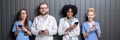 Medics with phones indoors Royalty Free Stock Photo