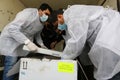 Medics and police officers check a shipment of the Russia`s Sputnik V vaccine for COVID-19 coronavirus disease