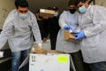 Medics and police officers check a shipment of the Russia`s Sputnik V vaccine for COVID-19 coronavirus disease