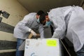 Medics and police officers check a shipment of the Russia`s Sputnik V vaccine for COVID-19 coronavirus disease