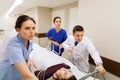 Medics with woman on hospital gurney at emergency Royalty Free Stock Photo