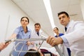 Medics with woman on hospital gurney at emergency Royalty Free Stock Photo