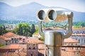 Medieaval italian city with binoculars on foregound Royalty Free Stock Photo