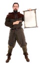 Medieval adventurer is holding a old scroll with copyspace Royalty Free Stock Photo