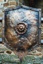 Medieval antique metal shield, with a textured surface