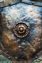 Medieval antique metal shield, with a textured surface