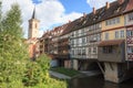 Medieval arch bridge KrÃ¤merbrÃ¼cke crossing river Gera with half-timbered shops and houses in the city of Erfurt, Germany