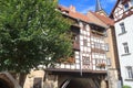 Medieval arch bridge KrÃ¤merbrÃ¼cke crossing river Gera with half-timbered shops and houses in the city of Erfurt, Germany