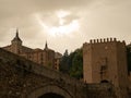 Medieval arch bridge on the Tagus River under the cloudy sky  in Toledo City, Spain Royalty Free Stock Photo