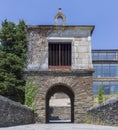 Medieval arched gateway entrance to Portomarin, Camino de Santiago, Spain.