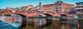 Medieval arched river bridge with Roman origins - Ponte Santa Trinita over Arno river. Panoramic summer cityscape of Florence, Ita