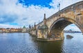The medieval arched Charles Bridge on Vltava River, Prague, Czechia