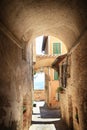 Medieval arched street in the old town of Montepulchano, Italy