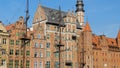 Medieval Architecture In Gdansk, Poland And Mast Of An Old Sailing Galleon Ship