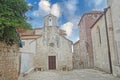 Medieval architecture on island Korcula, Dalmatia, Croatia, an old church and narrow stone street, Mediterranean