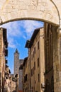 Medieval architecture of San Gimignano, towers and houses in narrow street, Tuscany