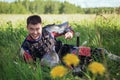 A medieval Asian warrior in armor is resting while sitting in tall grass Royalty Free Stock Photo