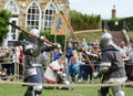 Medieval battle re-enactment between two fighters at Tonbridge C Royalty Free Stock Photo