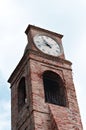 A medieval bell and clock tower of an ancient church Italy, Europe Royalty Free Stock Photo