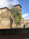 Medieval brick castle Rocca Sanvitale covered with water moat across blue sky. Fontanellato, Parma, Italy Royalty Free Stock Photo