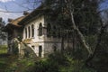 Medieval brick with timber-framed Village Manor House and gardens and untended greenery. Royalty Free Stock Photo