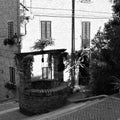 A medieval brick water well in the middle of a staircase in an ancient Italian village Corinaldo, Marche Royalty Free Stock Photo