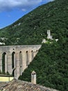 Medieval bridge and castle ruins on mountain side Royalty Free Stock Photo