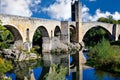 Medieval bridge over the Fluvia river in the village of Besalu, Girona, Catalonia, Spain Royalty Free Stock Photo