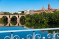 Medieval bridge over the Tarn river in Montauban city on sunny day