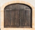 Medieval Brown Wooden Door in Stone Wall