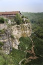 Medieval building on a high cliff above the mountain valley in the famous ancient city-fortress of Chufut-Kale, Russia Royalty Free Stock Photo