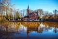 Medieval building (Castle) in Love lake, Minnewater Park in Bruges, Belgium. Royalty Free Stock Photo