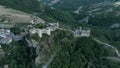 Medieval castle of Roccascalegna laying over green mountains in southern Italy